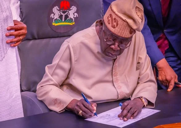 tinubu signs